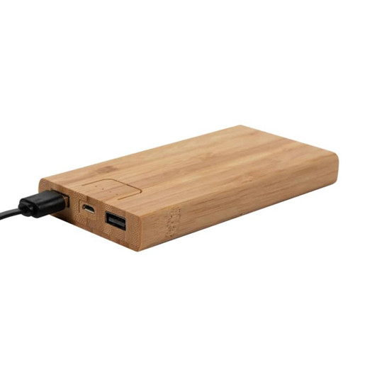 A bamboo wireless power bank in natural wood tones, featuring USB ports and a charging cable attached.