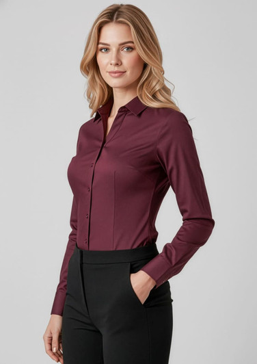 A long-sleeve women's button-up shirt in burgundy, featuring a fitted design and a collar.