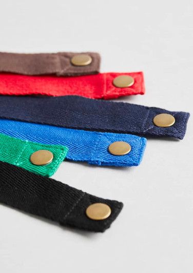 A selection of Urban Bib Straps in red, blue, green, black, and brown, featuring brass snaps.