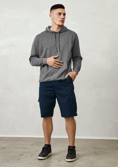 A model stands wearing grey hoodie and navy dress shorts with pockets, complemented by black sneakers.