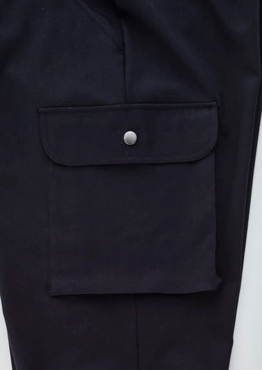 A pair of black cargo pants featuring a large side pocket with a snap closure and a smooth fabric finish.