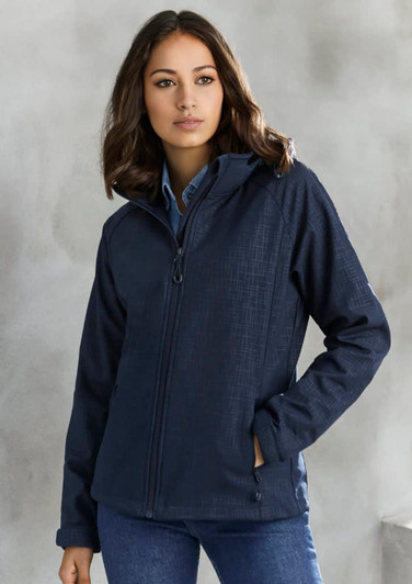 A women's soft shell jacket in navy with a subtle geometric pattern and a zip front. It features a hood and has a logo.