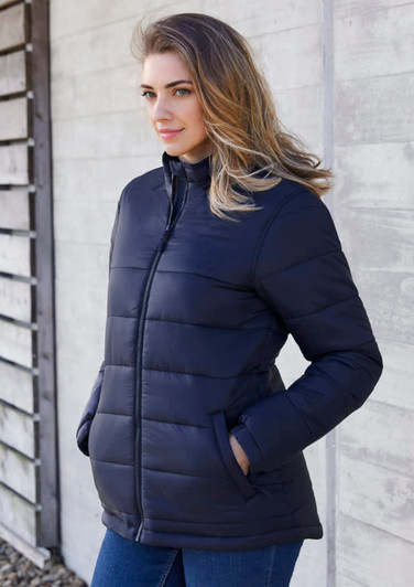 A women's puffer jacket in navy blue, featuring a zip front, side pockets, and a fitted design.