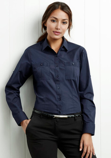 A navy women's button-up long sleeve shirt with two chest pockets and a slim fit. It has a logo on it.