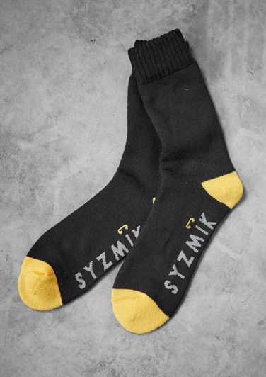 Bamboo work socks in black with yellow accents, featuring branding on the side. Pack includes three pairs.