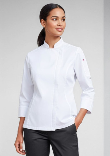 A white women's long sleeve chef jacket with a fitted design and a logo on one sleeve.