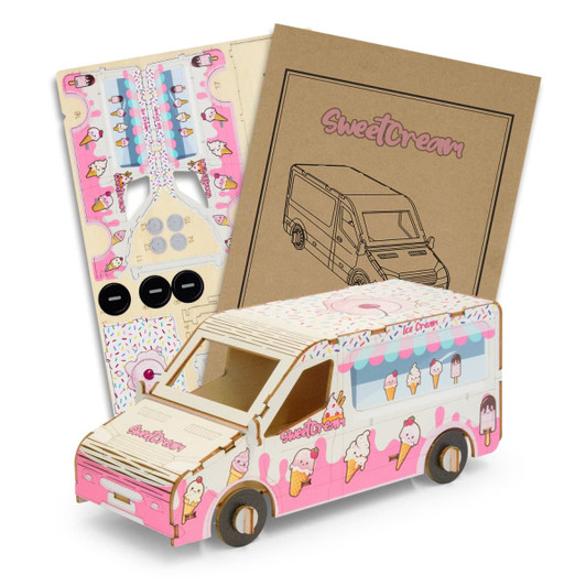 A pink and white wooden ice cream van model kit with assembly instructions and parts.