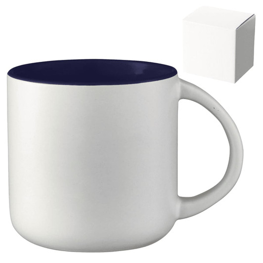 A ceramic mug with a white body and navy blue rim, presented with a plain gift box.