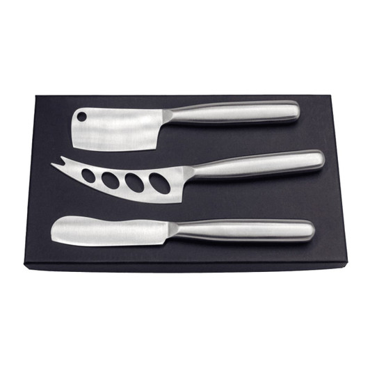 A stainless steel cheese knife set in a black box, featuring three knives of different shapes and sizes.