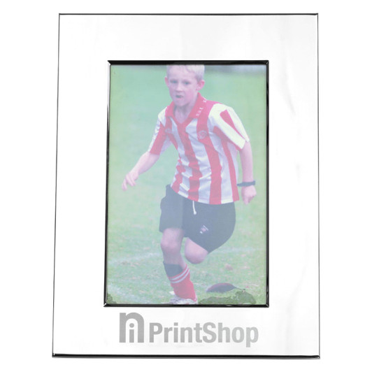 A nickel-plated photo frame with a glossy finish, displaying a photo of a child in a striped jersey.