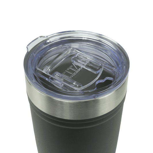 A drink bottle featuring a black exterior, stainless steel rim, and a clear, plastic lid with a straw opening.