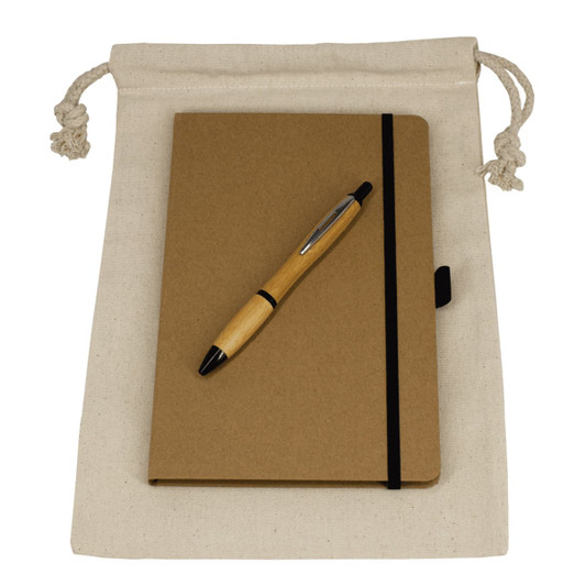 A drawstring bag in cream contains a brown journal book and a wooden pen. The set is neatly arranged for display.