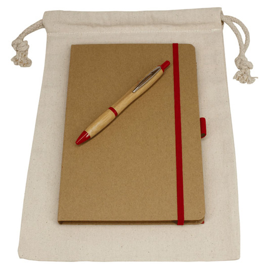 A drawstring bag in natural colour containing a brown journal book with a red elastic band and a red pen.