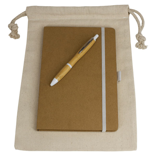A natural-coloured drawstring bag containing a brown journal book and a wooden pen. The bag has a branding logo.