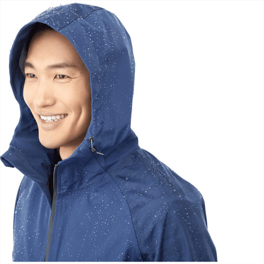 A blue softshell jacket for men with a hood, featuring water droplets, and a logo on the chest area.