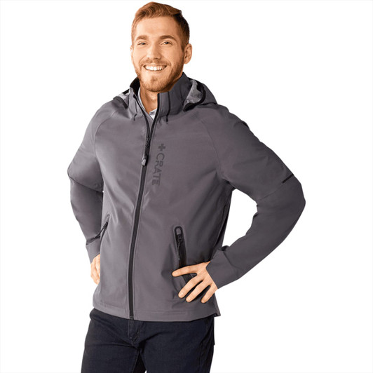 A men's softshell jacket in grey, featuring a hood and a logo, displayed by a smiling model.
