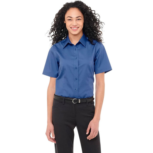 A short sleeve women's button-up shirt in a vibrant blue colour, featuring a collar and a logo.