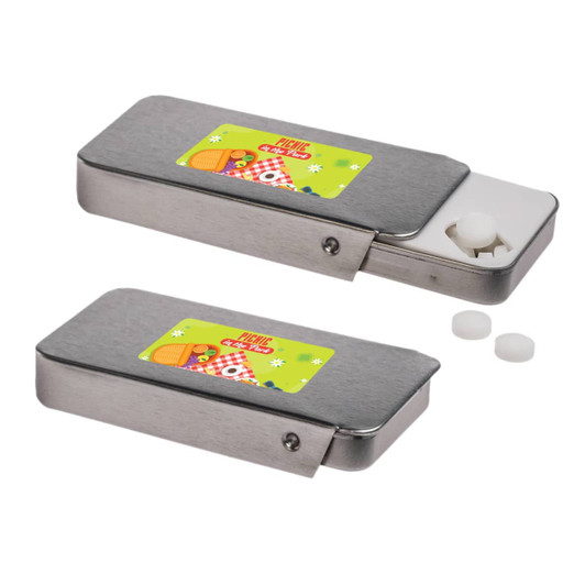 A silver slider tin filled with sugar-free breath mints, featuring a colorful label and two mints beside it.