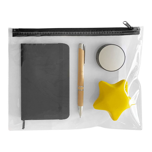 A clear pouch containing a grey notebook, a bamboo pen, a mirror, and a yellow star-shaped stress ball.