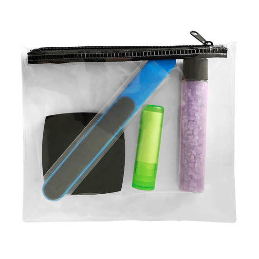 A clear pouch containing a nail file, lip balm, and a container of purple bath salts, alongside a black compact.