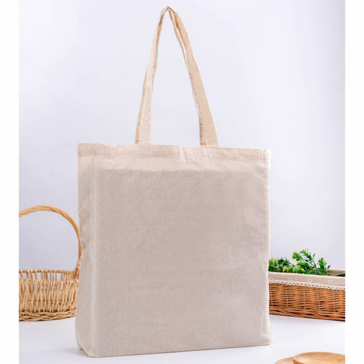 A neutral-coloured calico tote bag with gusset and long handles is displayed against a light background.