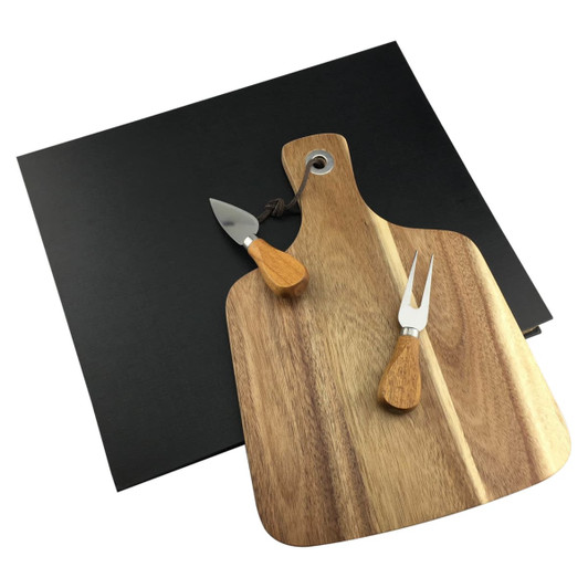 A wooden cheeseboard with two stainless steel knives and a black serving platter.