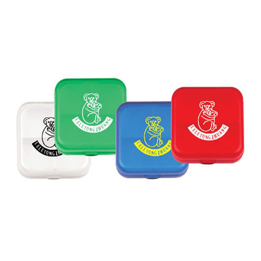 A set of four pill boxes in red, green, blue, and white, each featuring a logo.