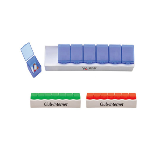 A weekly pill box in blue and white, featuring multiple compartments and a logo, with two additional green and red strips.