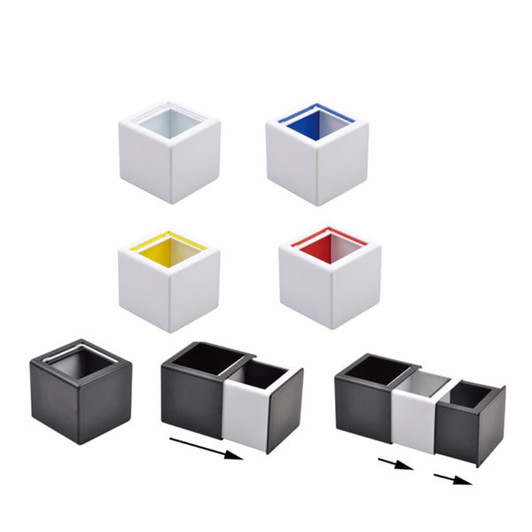A collection of square pen holders in black, white, yellow, and red, arranged in various configurations.