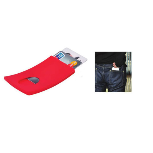 A red business card holder displaying a few cards and partially inserted into a trouser pocket.