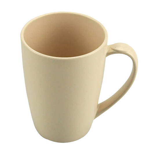 A bamboo mug in a beige colour with a smooth surface and a comfortable handle. It features a subtle logo.