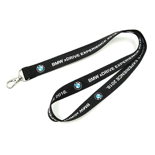 A black polyester lanyard with a clasp and printed branding. It features a sturdy design suitable for events.