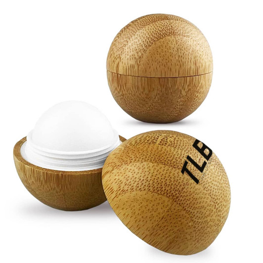 A bamboo lip balm ball in a round case, featuring a smooth white balm and a logo on the exterior.