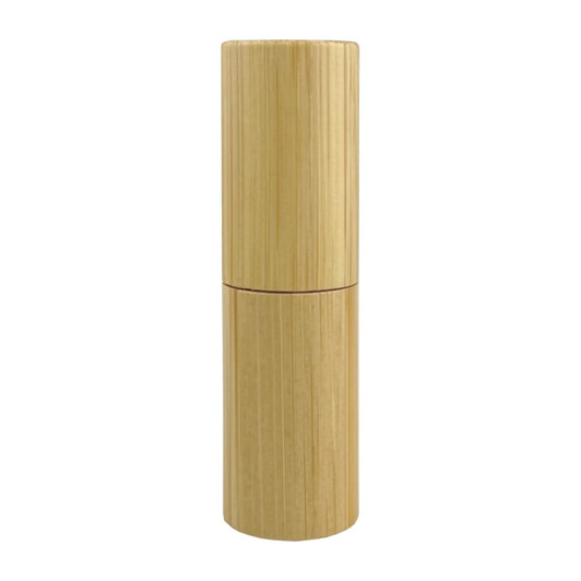 A cylindrical bamboo lip balm stick with a natural finish. It features a simple design and a logo.