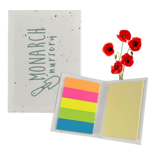 A sticky note pad with a speckled cover featuring a logo, containing colourful sticky notes in pink, orange, green, and yellow.