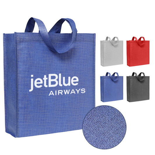 A blue patterned non-woven tote bag with handles and a logo, accompanied by grey, red, and black versions.