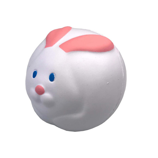 A round white stress relief toy shaped like a rabbit with pink ears and blue eyes. It has a simple, smooth design.