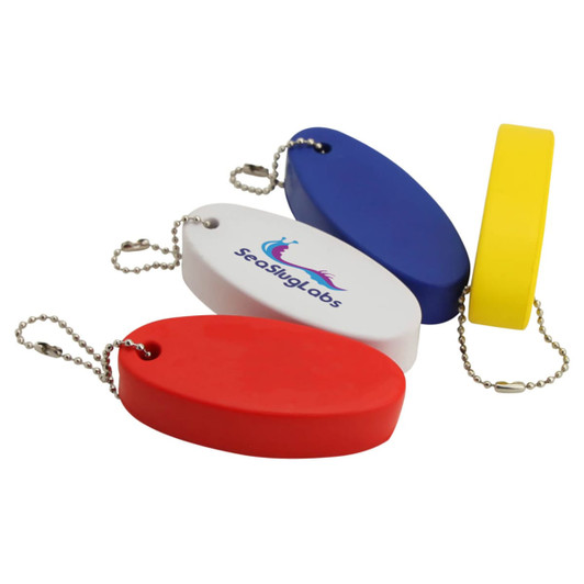 A collection of stress floating key rings in red, blue, white, and yellow, attached to chain links. Each has a branding logo.