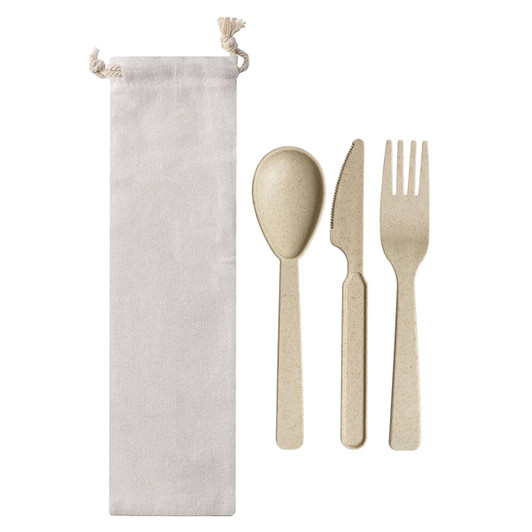 Wheat straw utensils in a cream bag, including a spoon, knife, and fork, all in a natural beige colour.