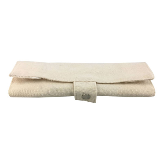 A bamboo utensils set wrapped in a beige fabric case with a button closure. Includes various cutlery pieces.