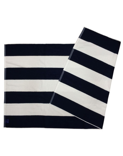 A striped beach towel featuring navy blue and white stripes, with a logo in one corner.