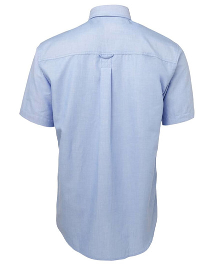 A light blue short-sleeve Oxford shirt with a back pleat and a logo on the label.