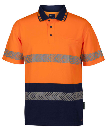 An orange polo shirt with grey reflective stripes and a navy blue bottom section, featuring a pocket and logo.