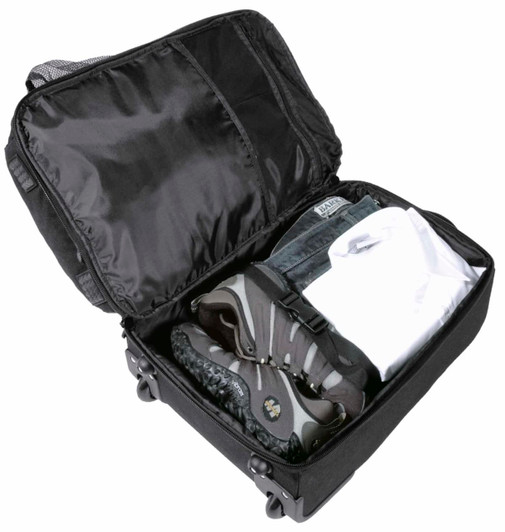 A black wheeled travel bag, open to reveal shoes, a shirt, and jeans neatly packed inside.