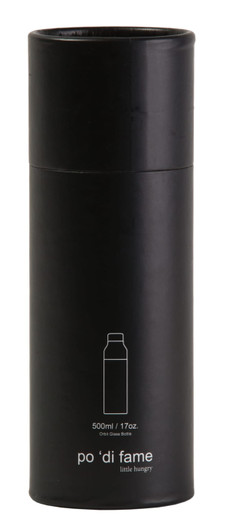 A drink bottle presented in a cylindrical black packaging. The bottle is transparent and has a black lid.