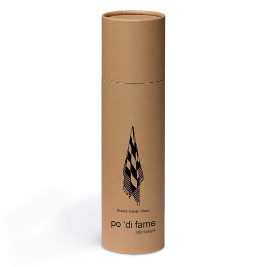 A cylindrical cardboard packaging for a Patara Turkish Towel featuring a checkered design and a branded logo.