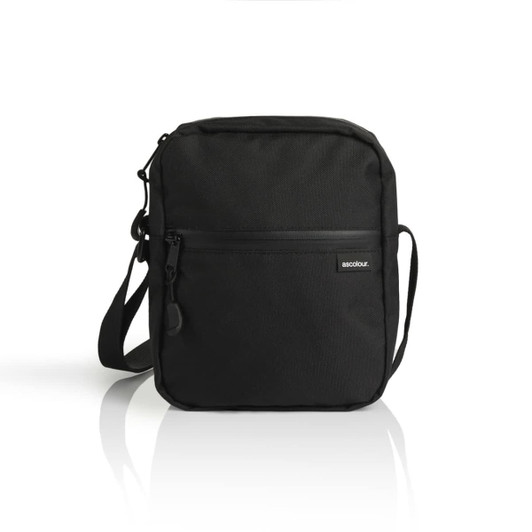A black recycled transit bag with a front zippered pocket and an adjustable shoulder strap. It features a logo.