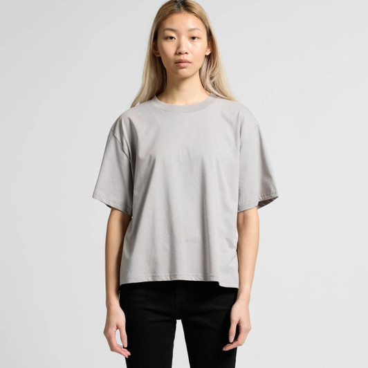 A light grey relaxed fit t-shirt featuring short sleeves. The design includes a subtle branding element.