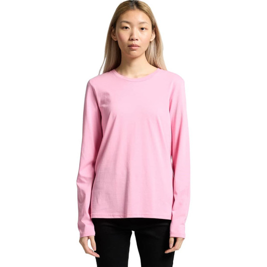 A long-sleeve pink t-shirt with a crew neckline and fitted silhouette. The shirt has a logo on it.