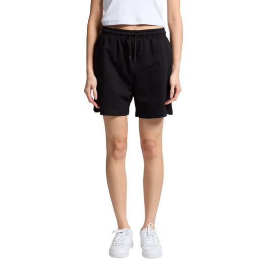 Black sports shorts with an elastic waistband, styled above the knee, worn by a model. Features a logo.